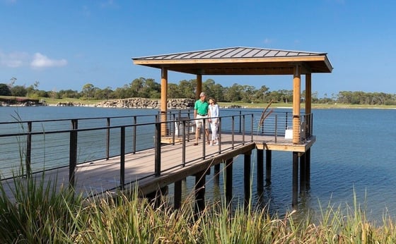 A Couple Walks on the Pier by Grande Lake