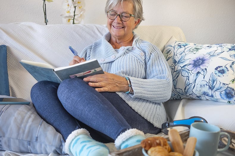 bigstock-Carefree-Senior-Woman-Writing--457842687