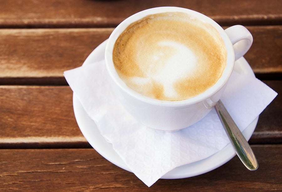 bigstock-Coffee-cup-on-wooden-table-13193966