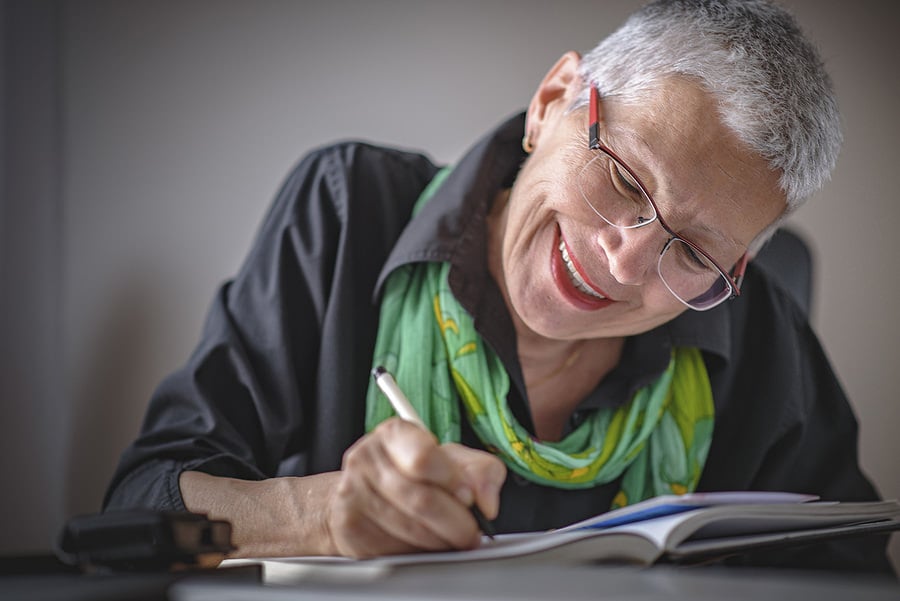 bigstock-Senior-Old-Woman-Writing-Down--226829248