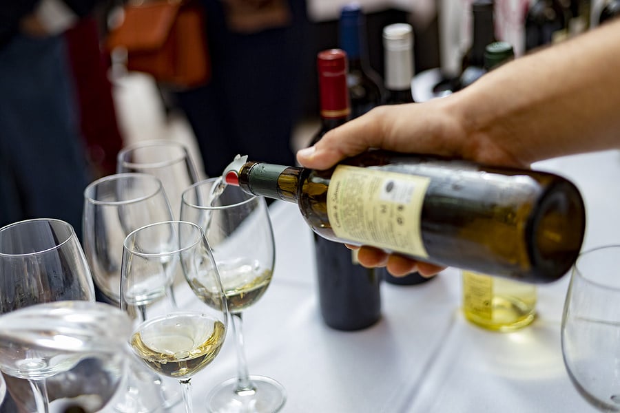 bigstock-Wine-Glass-Of-Wine-Hands-Ser-465013087 (1)