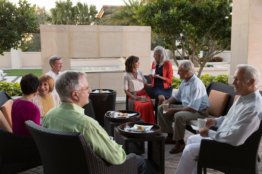 residents eating together outside at Moorings Park in Naples, Florida